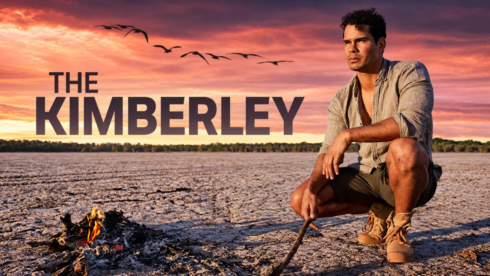 Key art for The Kimberley: a man crouches beside a small fire on a cracked salt pan at sunset as birds cross a coral sky.